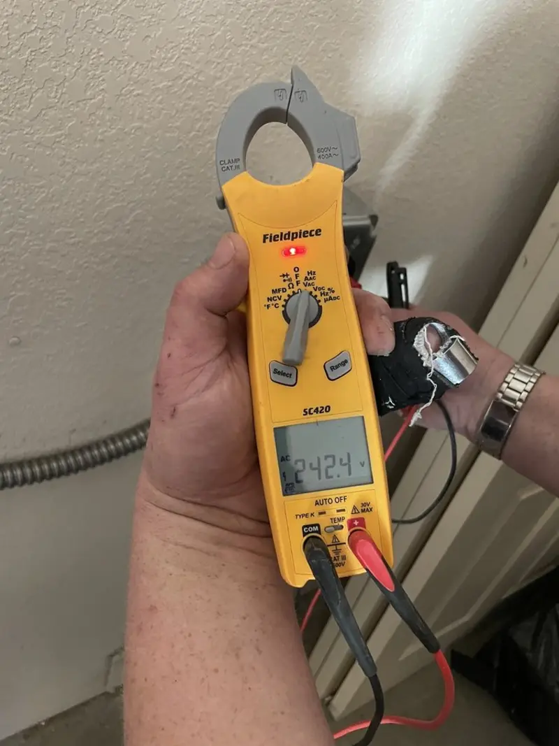 Voltage testing with clamp meter during Electrical Installation Services in Ellisville